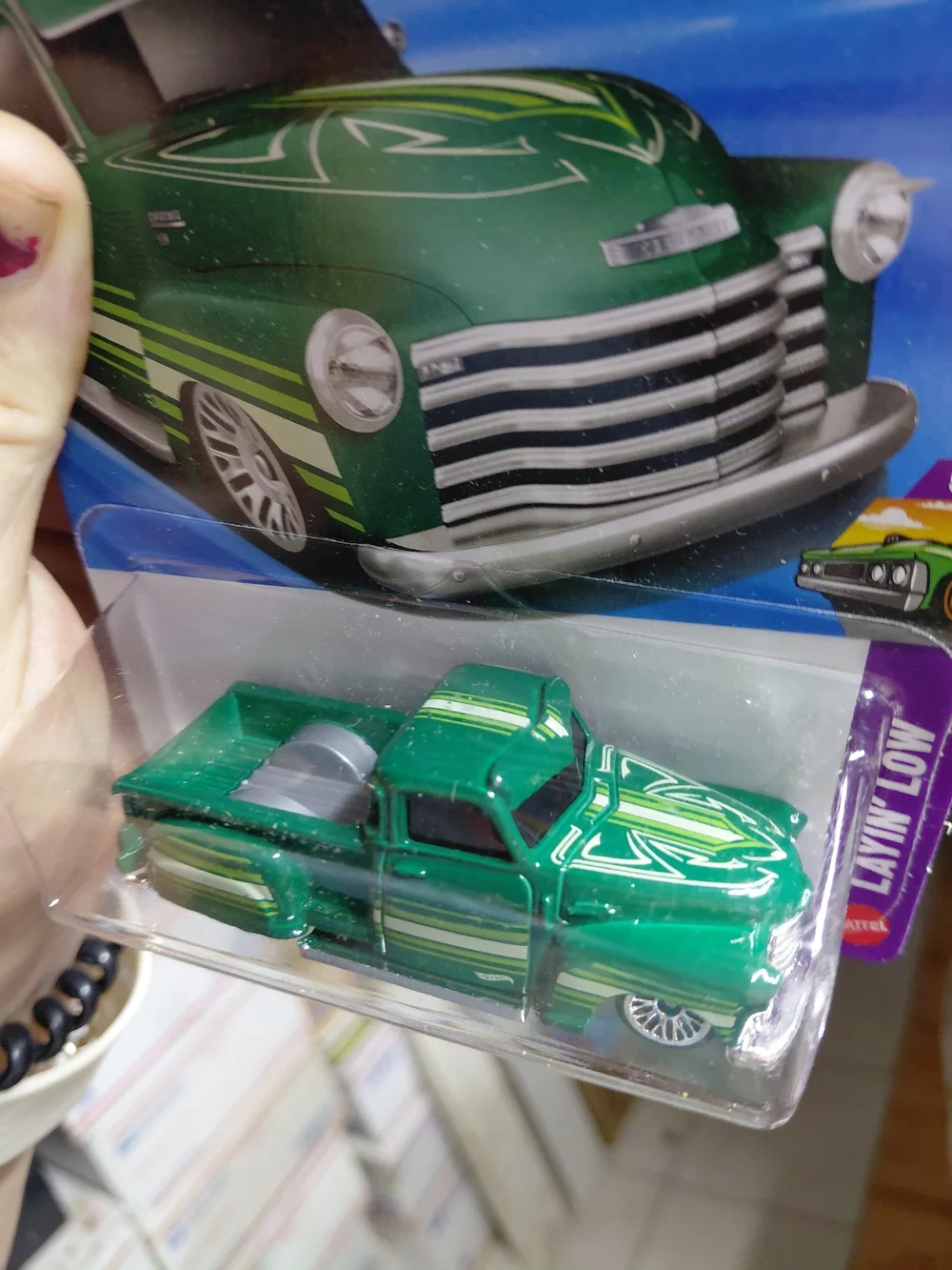 green Hot Wheels La Troca is a 1:64 scale die-cast lowrider pickup truck from th